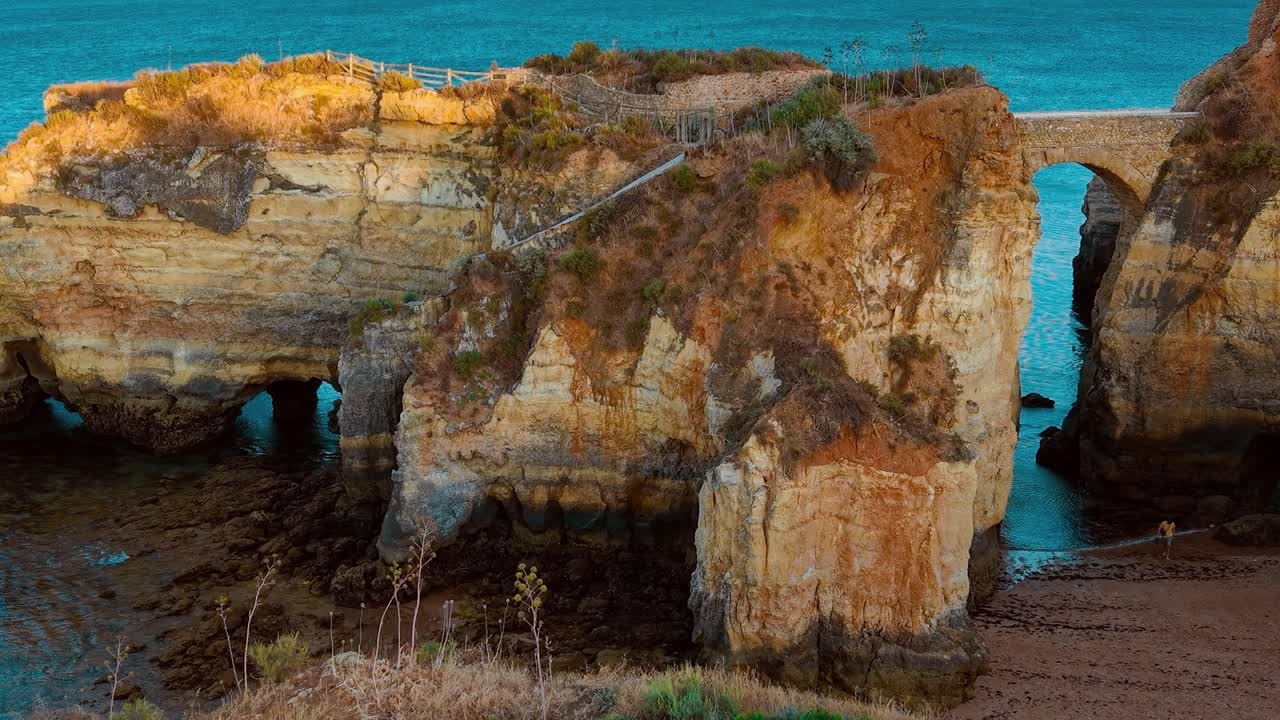 Exploring coastal rock formations near Lagos in Portugal during daylight