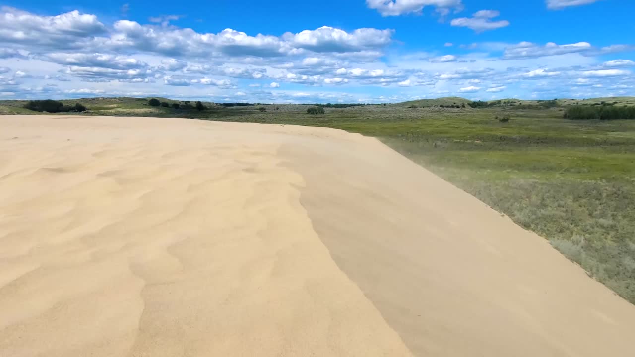 Desert and sand dunes in the country on a cloudy sunny day near Alberta Canada.