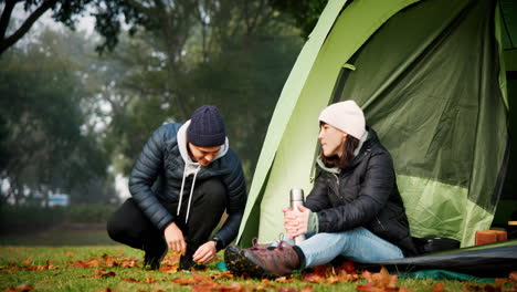 Couple,-talking-and-tent-outdoor-for-camping