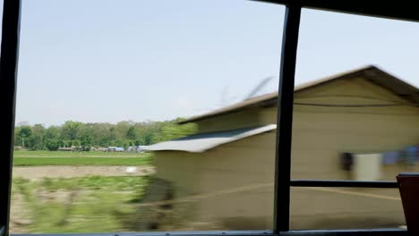 village view from the car. national park chitwan, nepal.