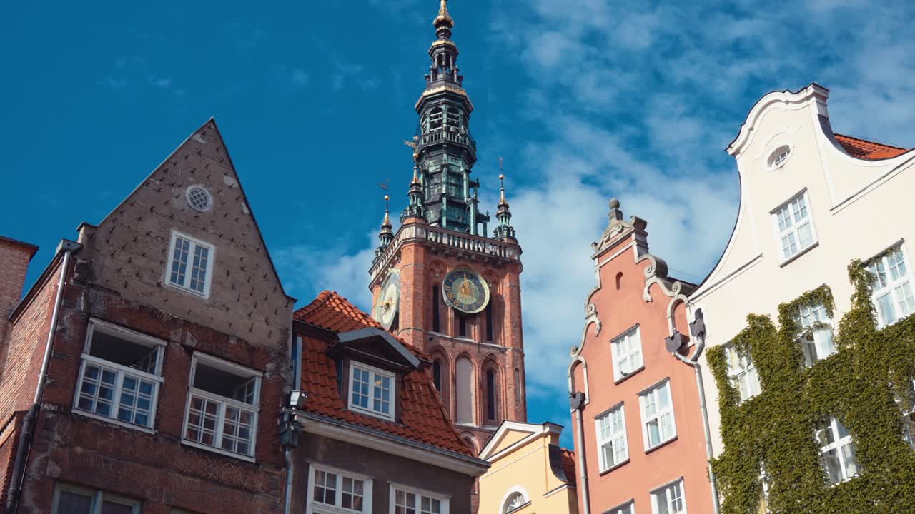 Closeup view of clock on St. Mary's Basilica in Gdansk, Poland on a bright sunny day.
