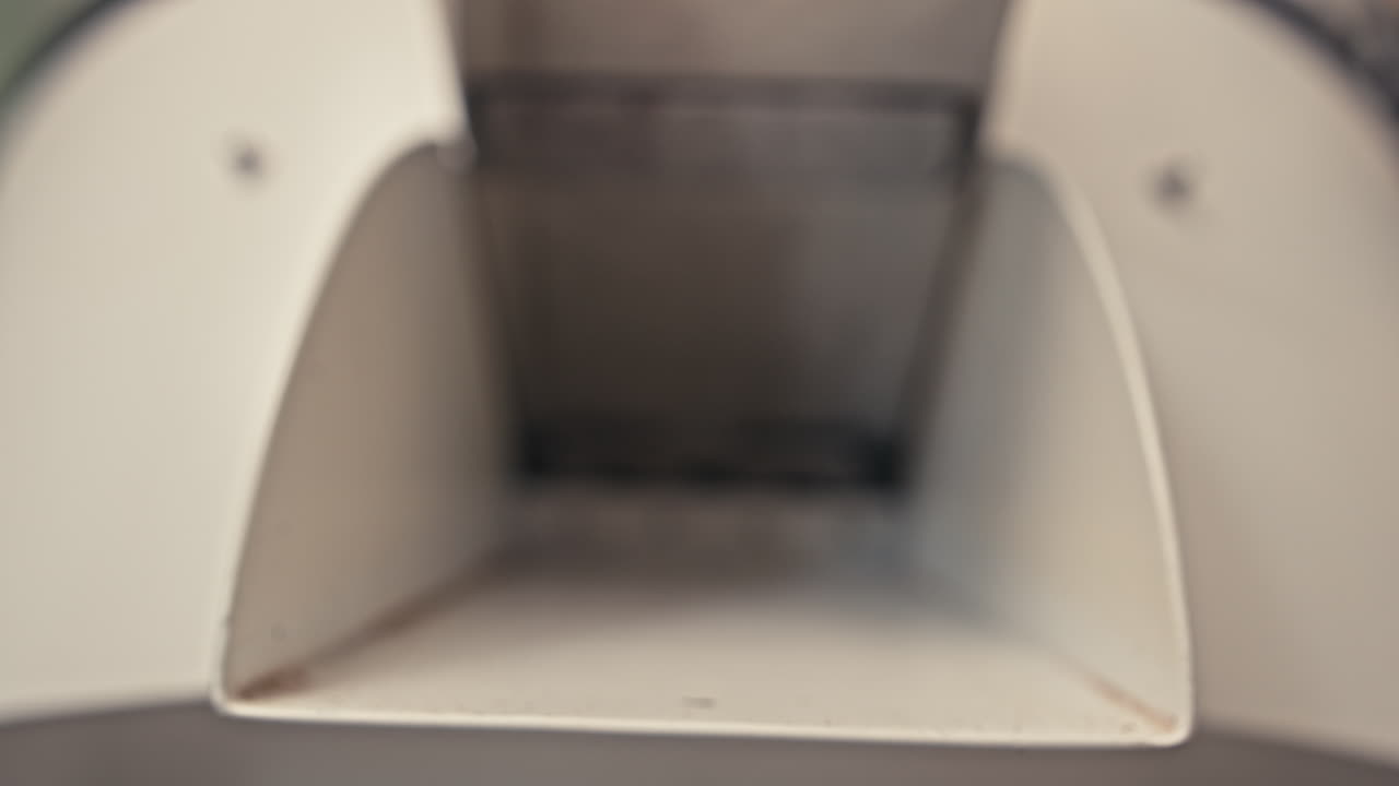 Coffee Beans Pouring from Grinder