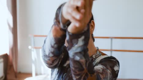 Woman practicing dance in a studio, close-up series