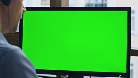 client service mockup computer screen closeup. chroma key green device in office