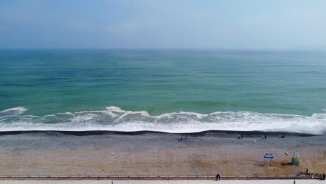 drone 4k footage of a rocky beach in lima, peru