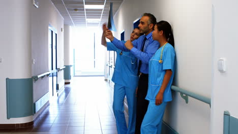 doctor and nurses looking at x-ray