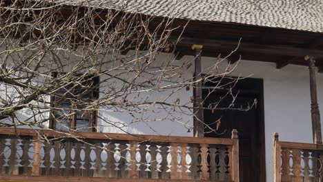 old wooden house with porch from 19th century