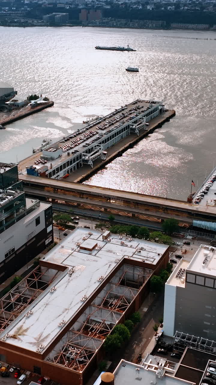 Parking lots of New York from aerial view. Car parks on the roofs of the building and piers. Vertical video