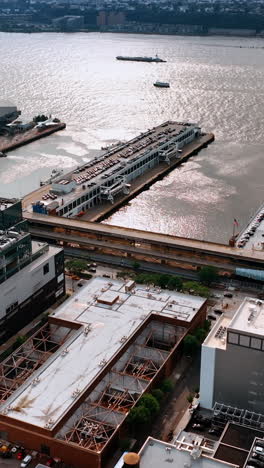 parking lots of new york from aerial view. car parks on the roofs of the building and piers. vertical video