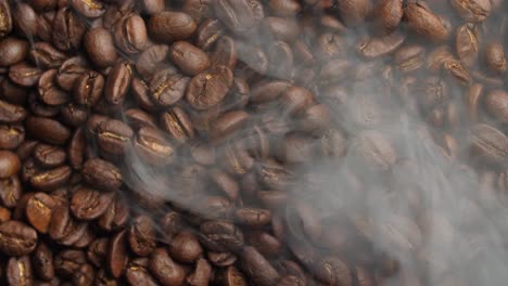 coffee beans rotating with smoke, video in 4k, 50fps