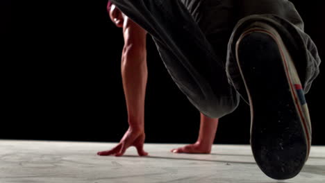 Cool-young-break-dancer-dancing-on-black-background