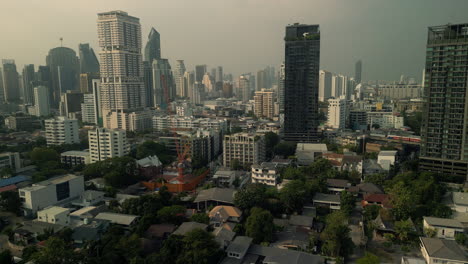 aerial view of cityscape with skyscrapers and construction