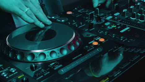 dj using mixer at the disco