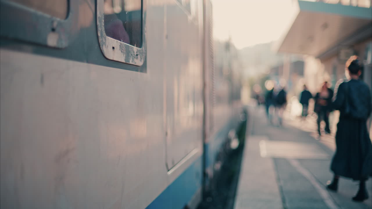 Blurry view of people and trains moving at the Nice Train Station