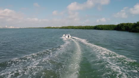 Aerial:-following-fast-speedboat-in-the-mexican-ocean-near-Cancun