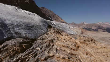 glacier in mountains circling aerial