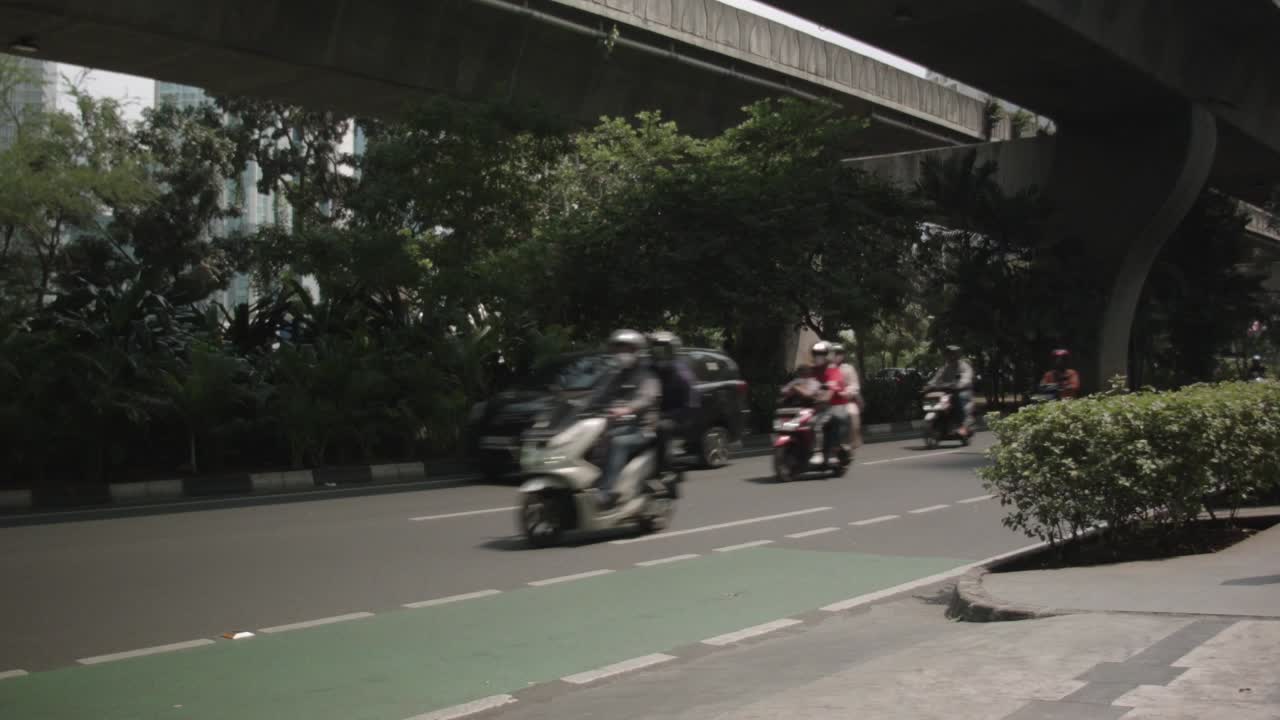 Traffic on a street under an overpass