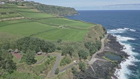 Green-landscape-on-high-cliffs-along-volcanic-coast-of-Santo-Antonio,-Sao-Miguel-island,-Portugal