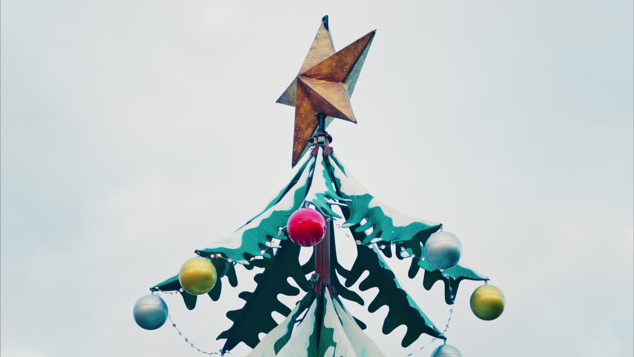 Close up of decorations on a metal rotating Christmas tree
