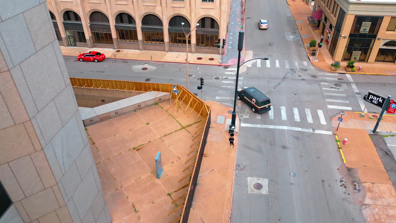 Saint Louis USA, 14 August 2025: Few cars ride by the empty road and cross the crossroads. Empty street of St. Louis, Missouri, USA. Aerial view