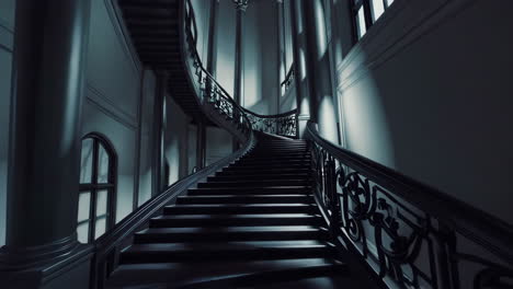 grand spiral staircase in a historic mansion