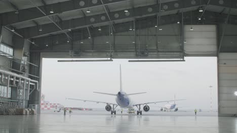 airplane hangar with aircraft