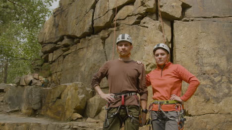 climbers at the bottom of the cliff