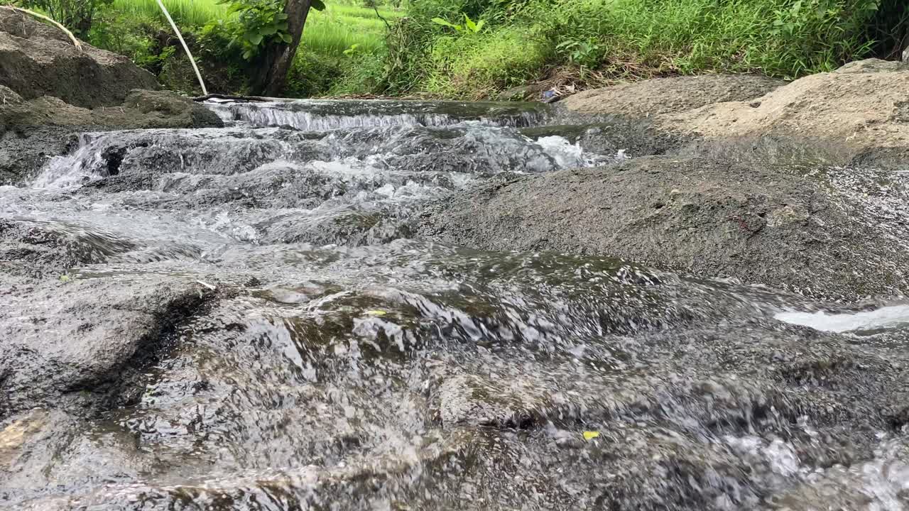 closeup of the clean gurgling of the river on the rocks