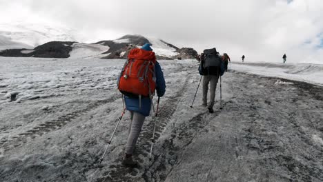 hikers on a glacier