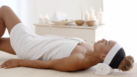 woman lays down on the massage desk