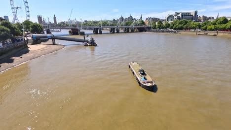 boat travels along the river thames