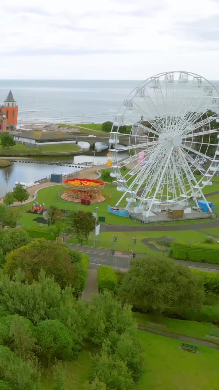Advancing social ratio aerial video GV of Swan Lake in Newcastle, County Down, Northern Ireland. Produced in 1920x1080 social ratio, 60FPS and with Rec709 color