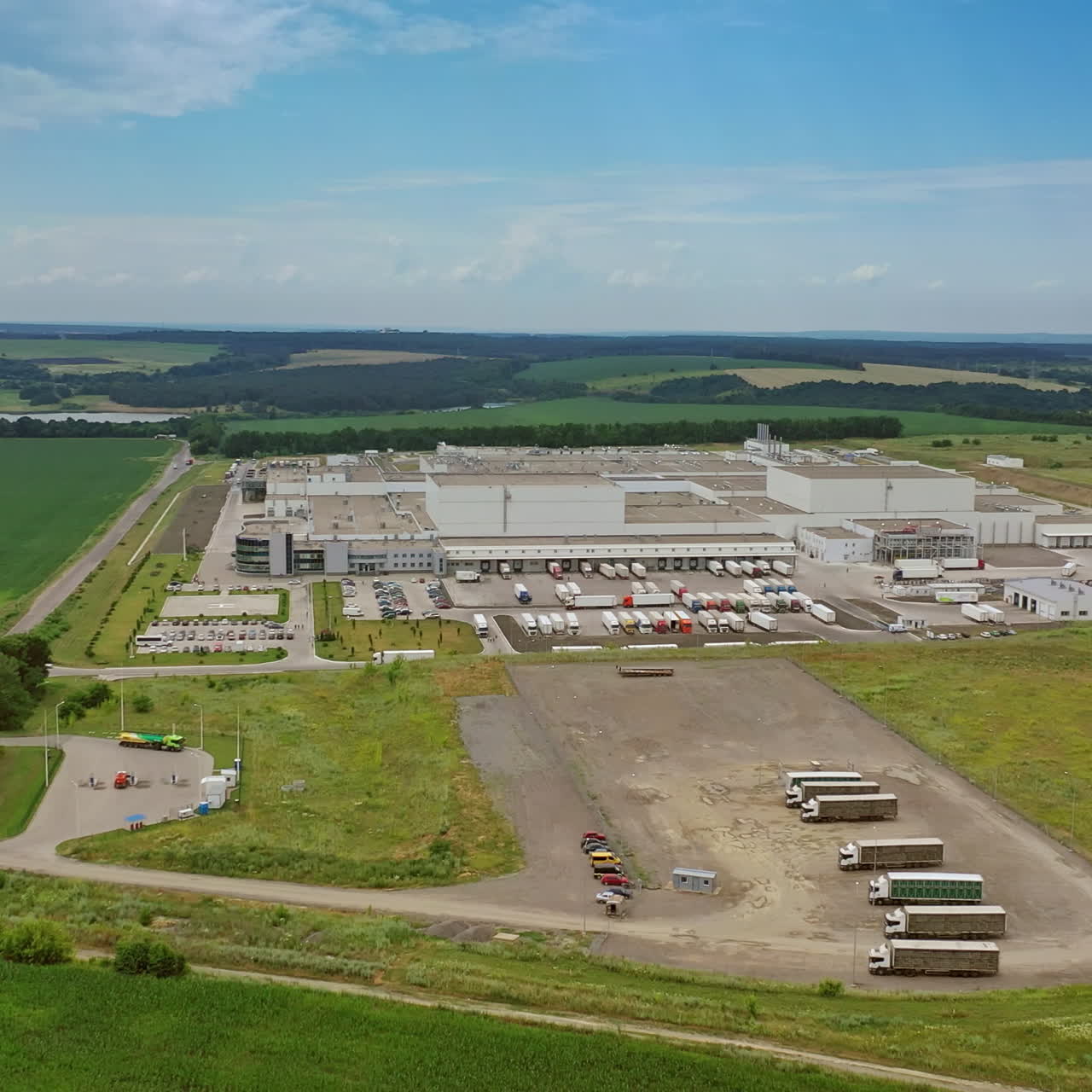 Aerial footage of a large industrial complex. Manufacturing plant. Industrial territory.