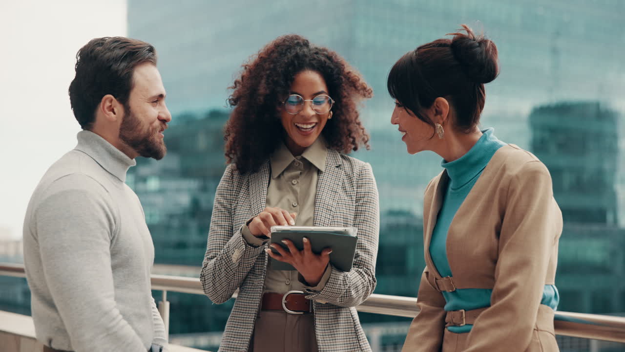 Business team collaborating outdoors with a tablet