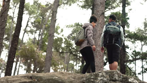 hiking, couple and support for rock climbing