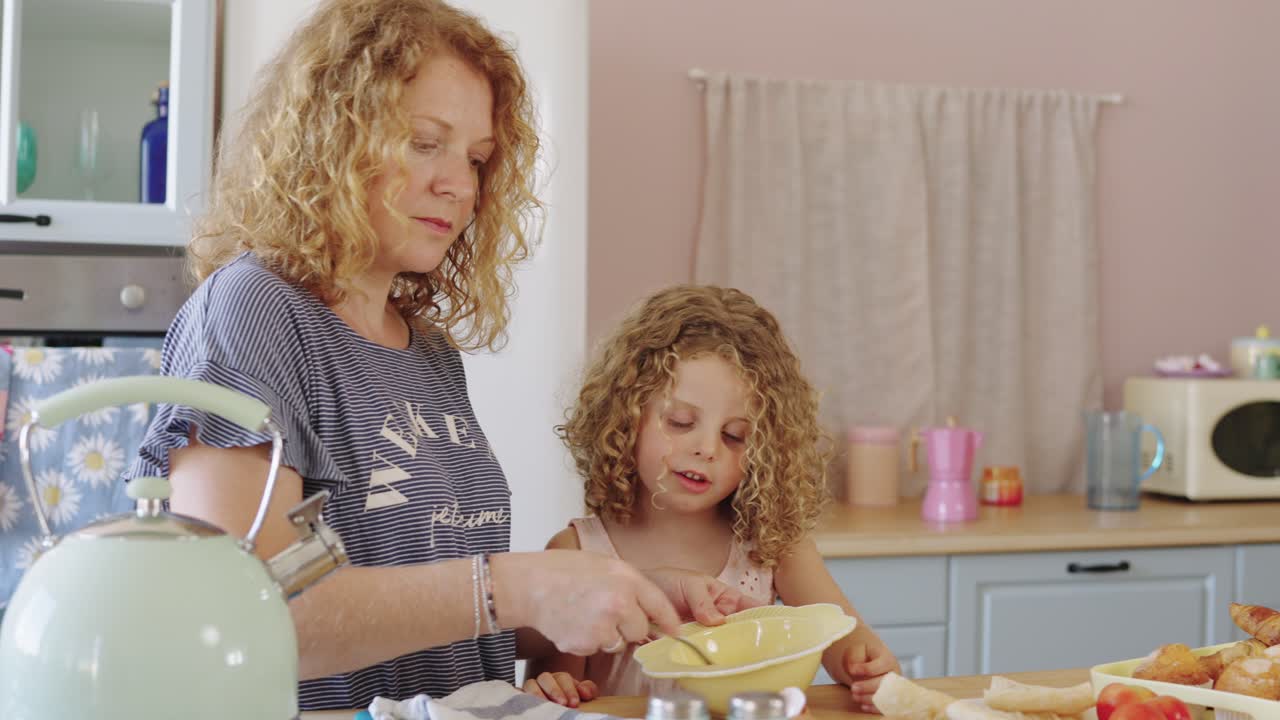 Mother and Daughter Cooking Together