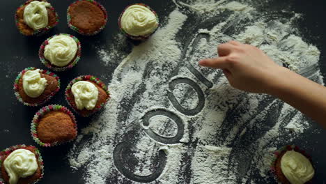 Cooking-concept.-Top-view-of-inscription-word-cooking-on-white-flour.