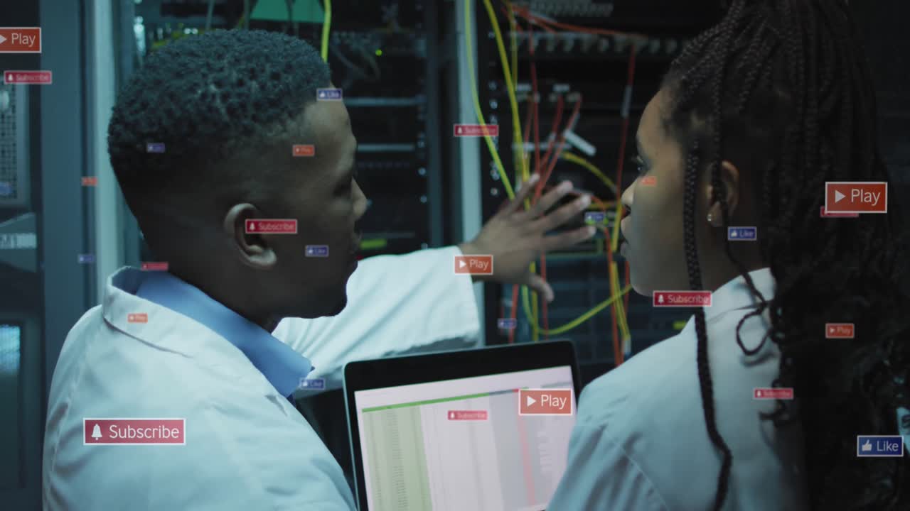 Animation of social media icons on african american male and female engineers working at server room