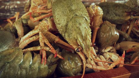 live crayfish on a wooden table