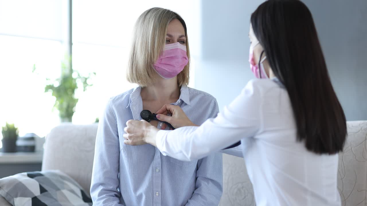 Doctor Examining Patient with Stethoscope During Pandemic