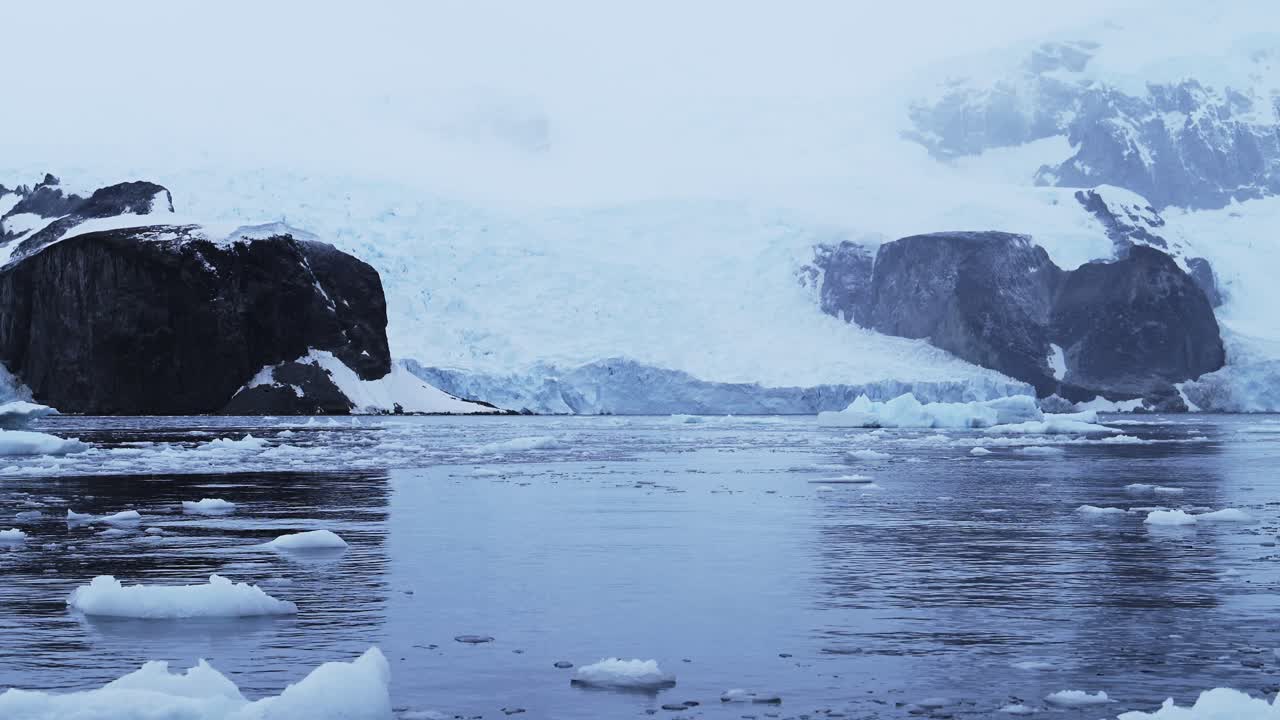 Aerial drone shot of Antarctica Landscape, Glacier and Mountain Scenery on the Antarctic Peninsula in the Southern Ocean, in a Snow and Ice Covered Landscape in Cold Weather