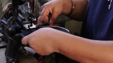 Mixed-race-woman-working-at-a-hat-factory