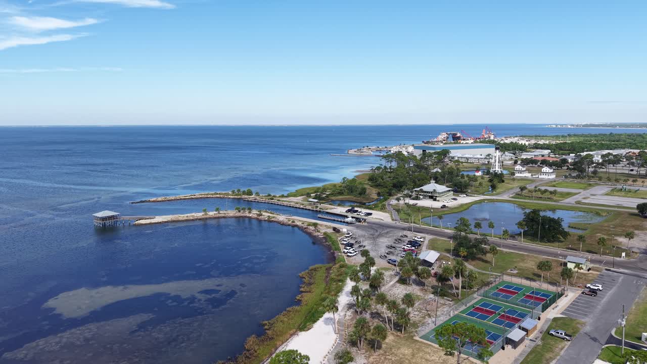 Drone orbit of Port St. Joe Gazebo and harbor pier with surrounding coastal settlement, Port St. Joe, Gulf County, Florida, USA