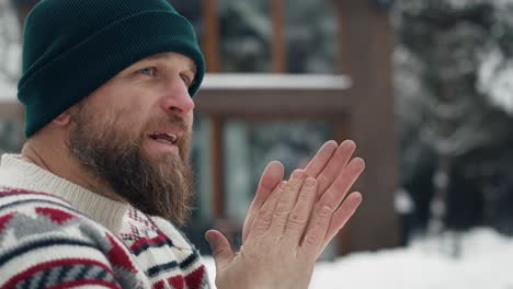 caucasian man trying warming up and standing outdoors.