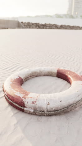 a life preserver on a sandy beach