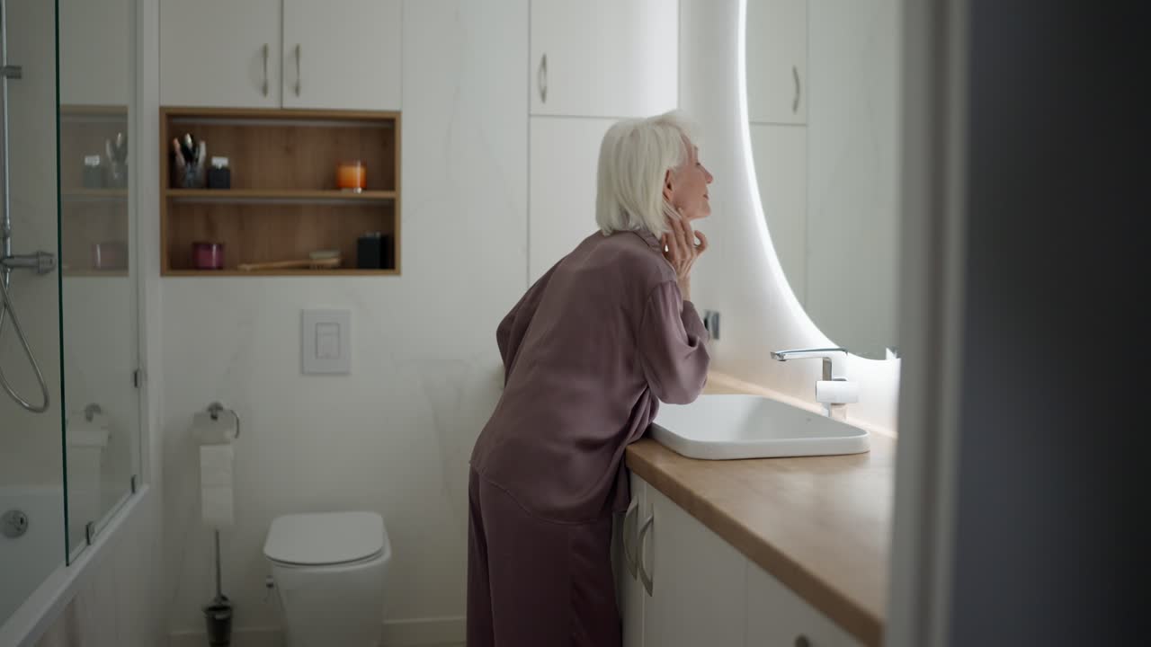 Elderly Woman in Bathroom