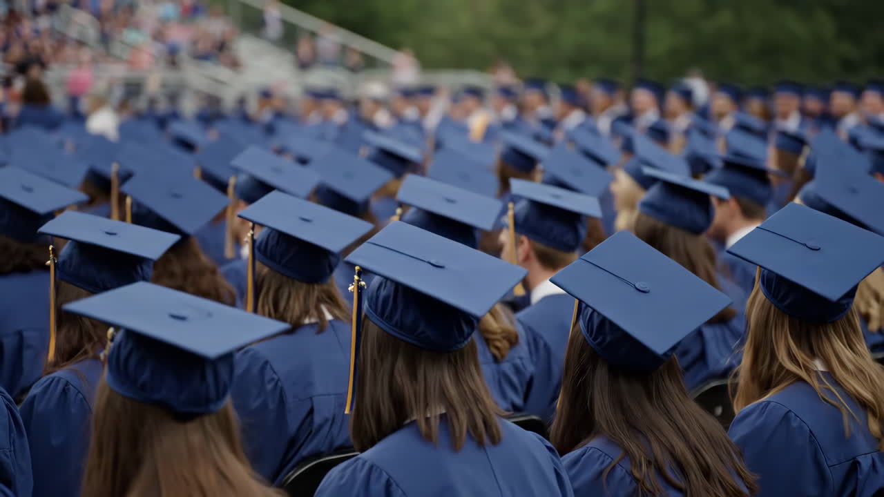 Graduates in caps and gowns attending a commencement ceremony