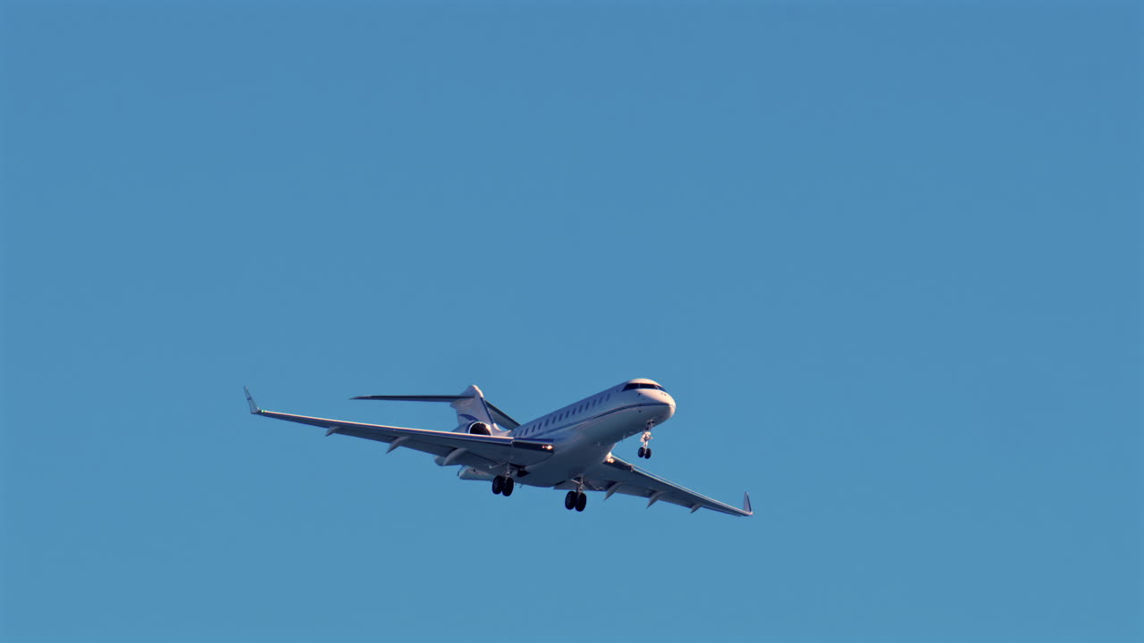 Nice, France - March 17, 2025: Airplane flying on the blue sky in daylight