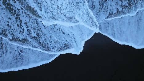 Foamy-Waves-Splashing-On-Lækjavik-Black-Sand-Beach-In-Iceland---Aerial-Top-Down