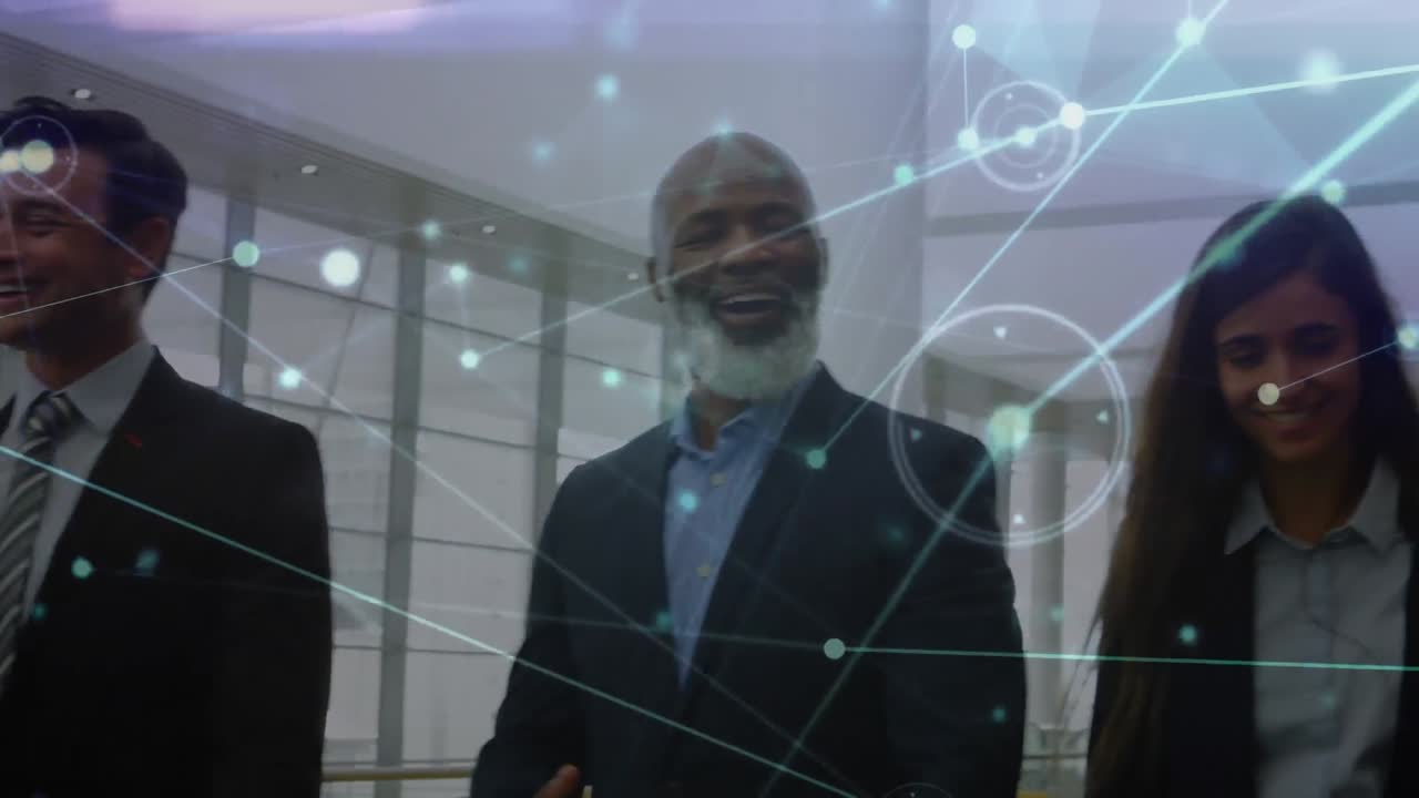 Animation of network of connections over happy diverse group of businesspeople walking at office